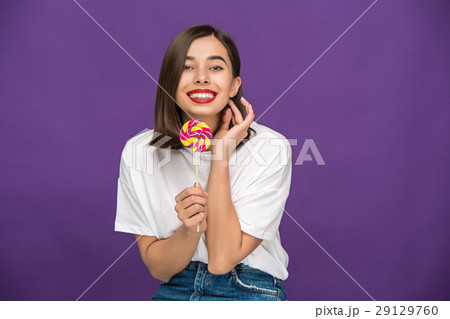 The young woman with colorful lollipop 29129760