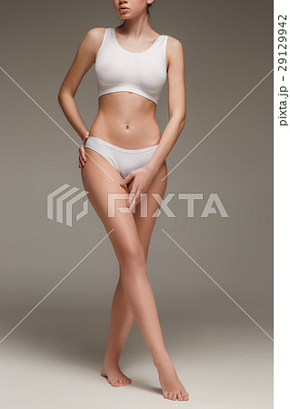 Young, slim, healthy and beautiful woman in white 29129942