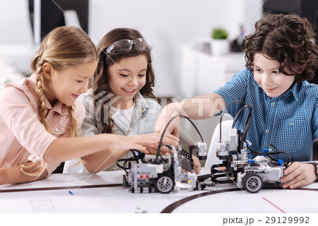 Cheerful kids working on the tech project at Cheerful kids working on the tech project at 29129992