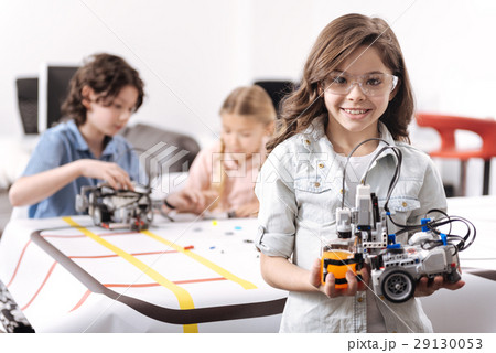 Optimistic girl demonstrating tech project at 29130053