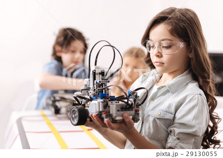 Concentrated girl having tech lesson at school 29130055