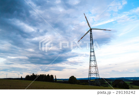 Turning wind engines in front of a dramatic sky Turning wind engines in front of a dramatic sky 29130242