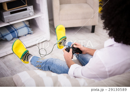 Hipster man playing computer games Hipster man playing computer games 29130589