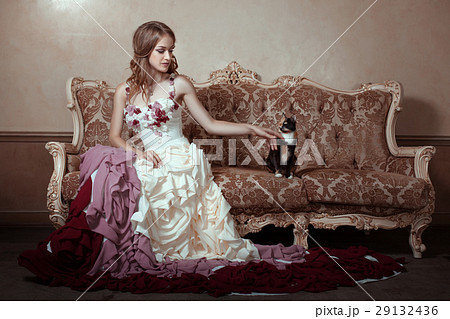 Girl in beautiful dress with a train. Girl in beautiful dress with a train. 29132436