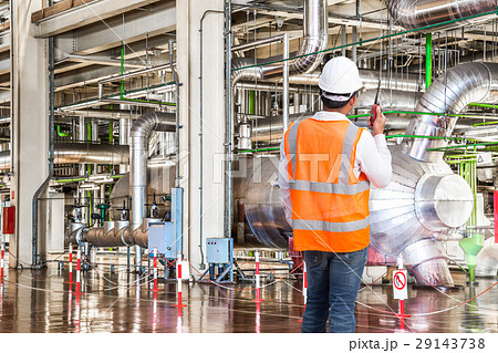 Engineer working in thermal power plant with radio Engineer working in thermal power plant with radio 29143738