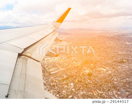 the airplane is taking off over city the airplane is taking off over city 29144317