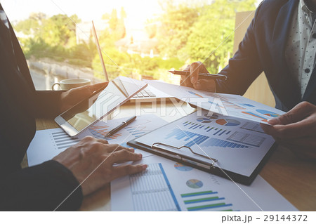 Business people discussing the charts and graphs 29144372