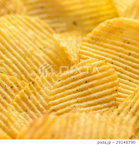 close up rippled natural potato chips with salt close up rippled natural potato chips with salt 29148790