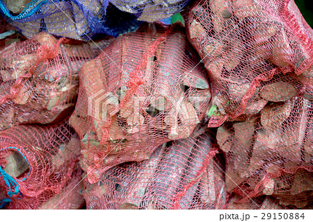 Firewood in net bag sold in the store 29150884