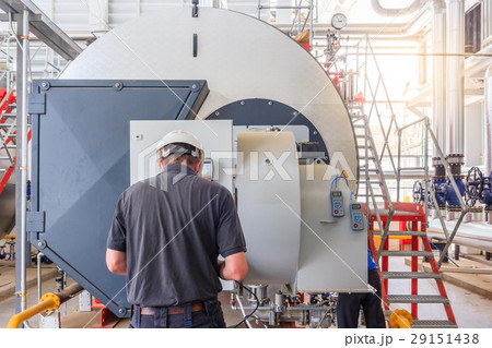 engineer work with gas boiler of heating system  29151438
