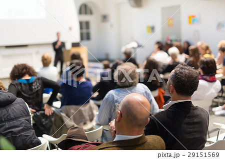 Woman giving presentation in lecture hall at 29151569