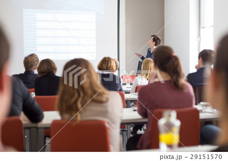 Woman giving presentation in lecture hall at Woman giving presentation in lecture hall at 29151570