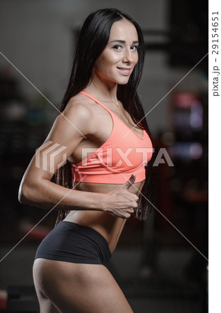 Athletic Young Sexy Fitness Woman Train And Exercising In Gym