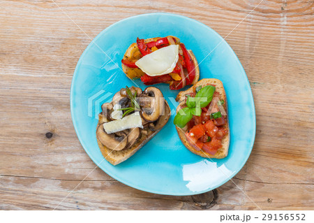 Bruschetta with tomatoes, mushrooms, goat's cheese 29156552