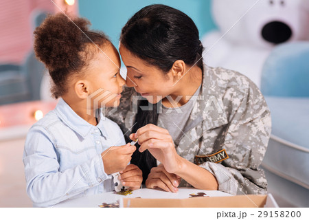 Stunning mom and daughter sharing a family moment Stunning mom and daughter sharing a family moment 29158200