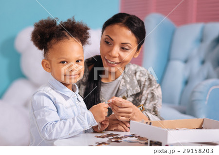 Sweet child and her mom enjoying every moment 29158203