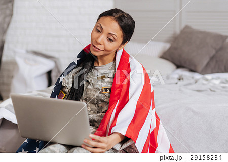 Lovely emotional woman making a call using webcam Lovely emotional woman making a call using webcam 29158234