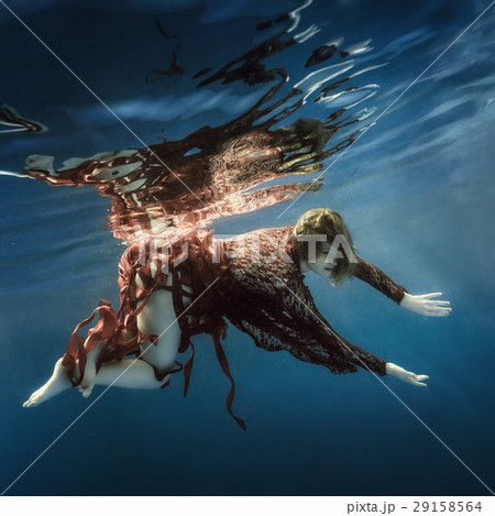 Portrait of a girl in a red dress underwater 29158564