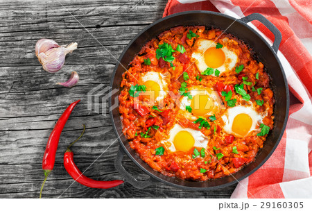 shakshuka - eggs, onion, bell pepper, tomatoes 29160305