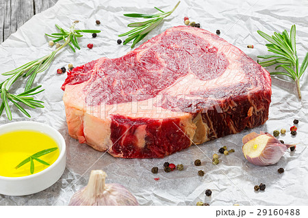 raw beef rib eye fresh meat steak on white paper raw beef rib eye fresh meat steak on white paper 29160488