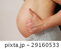 Happy husband showing OK sign on pregnant wife belly 29160533