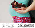 Happy young parents show toy of their future baby 29160535