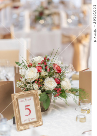 red and ivory floral arrangement for wedding 29161051