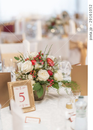 red and ivory floral arrangement for wedding 29161052