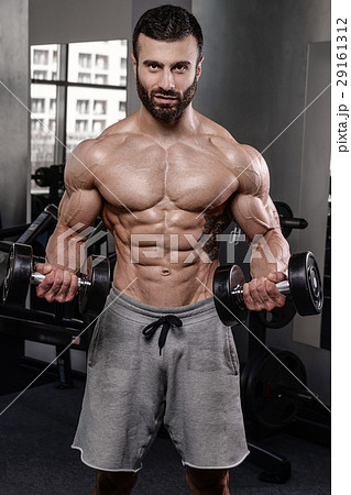 Handsome fitness model train in gym gain muscle Handsome fitness model train in gym gain muscle 29161312