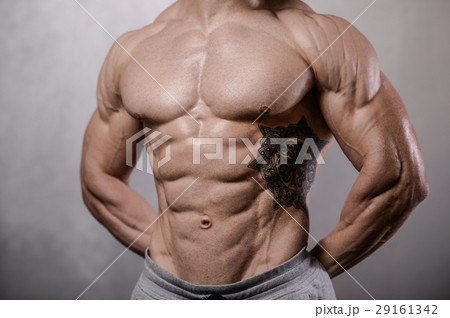 Handsome fitness model train in gym gain muscle Handsome fitness model train in gym gain muscle 29161342