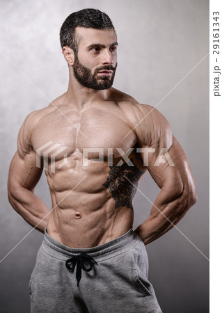 Handsome fitness model train in gym gain muscle Handsome fitness model train in gym gain muscle 29161343