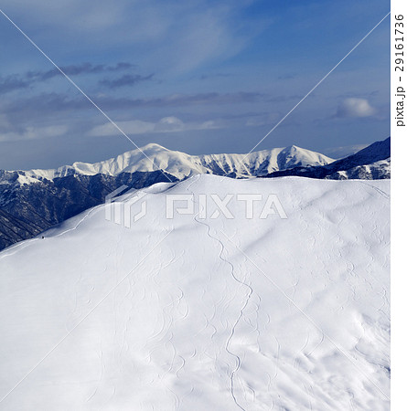 Ski slope for freeride with trace from snowboard Ski slope for freeride with trace from snowboard 29161736