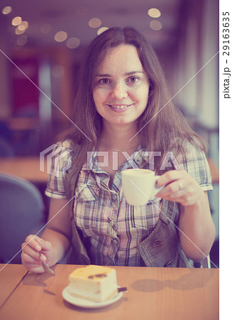 Adult girl drinking morning coffee Adult girl drinking morning coffee 29163635