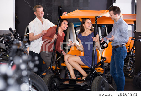 Family selecting grand tour electric at rental 29164871