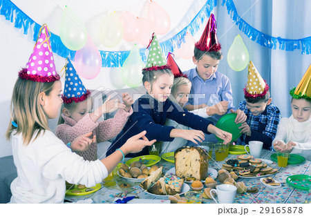 Children having birthday dinner 29165878