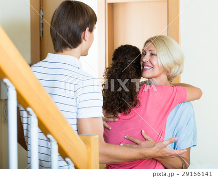 Mature woman visiting adult kids at their place 29166141