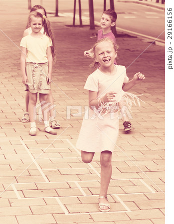 children skipping hopscotch 29166156