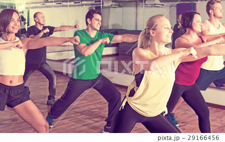 Men and ladies dancing zumba 29166456