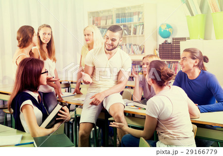 students chatting while sitting in the room students chatting while sitting in the room 29166779