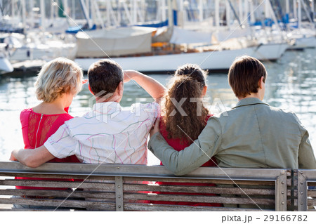 Happy family of four enjoying together near sea 29166782