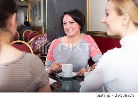 Three woman sitting in cafe Three woman sitting in cafe 29166875