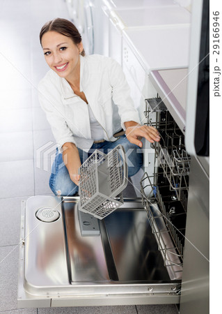 Woman selecting modern dishwasher Woman selecting modern dishwasher 29166946