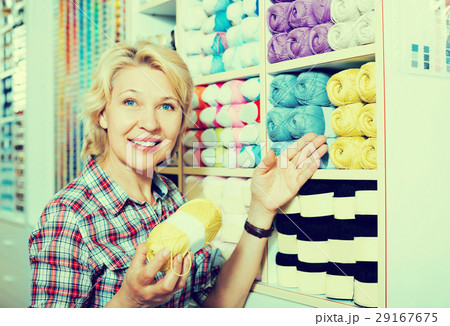 Woman selecting multicolored yarn 29167675