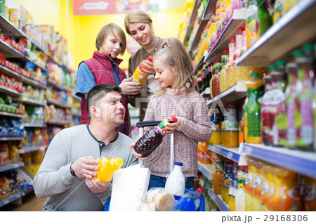 Parents with two kids choosing soda Parents with two kids choosing soda 29168306