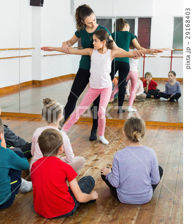 Young ballet dancers exercising in ballroom 29168403