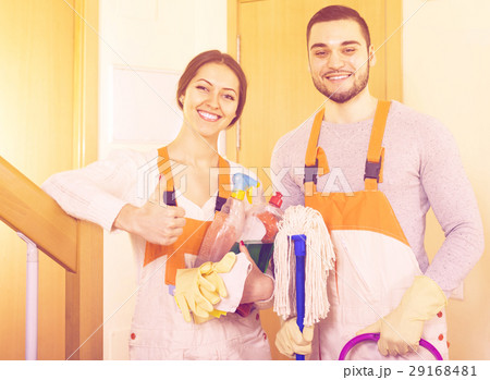 cleaners cleaning in room 29168481