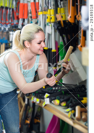 woman selecting gardening equipment woman selecting gardening equipment 29169318