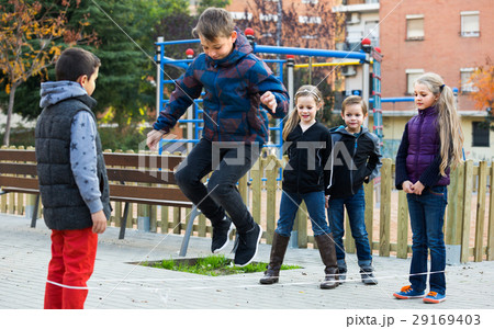 children playing rubber band children playing rubber band 29169403