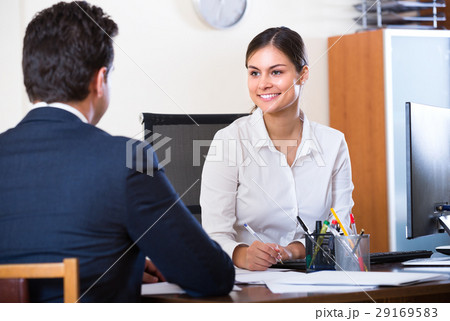 Businessman and secretary working in office . Businessman and secretary working in office . 29169583