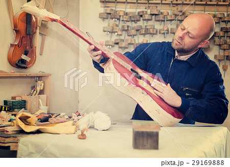 Guitar-maker at workshop. Guitar-maker at workshop. 29169888